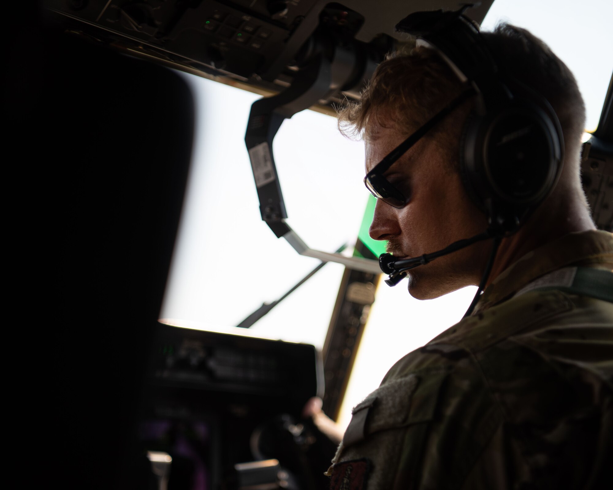 A pilot stares at a control panel