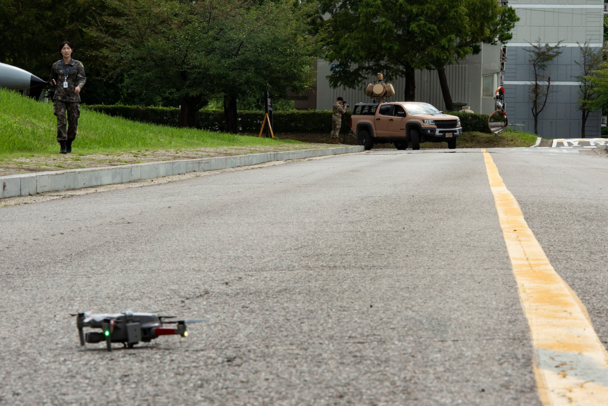 A drone sits inactive on a street after being brought down by combined forces as part of a counter small unmanned aircraft systems exercise scenario during Ulchi Freedom Shield 25 at Osan Air Base, Republic of Korea, Aug. 19, 2025