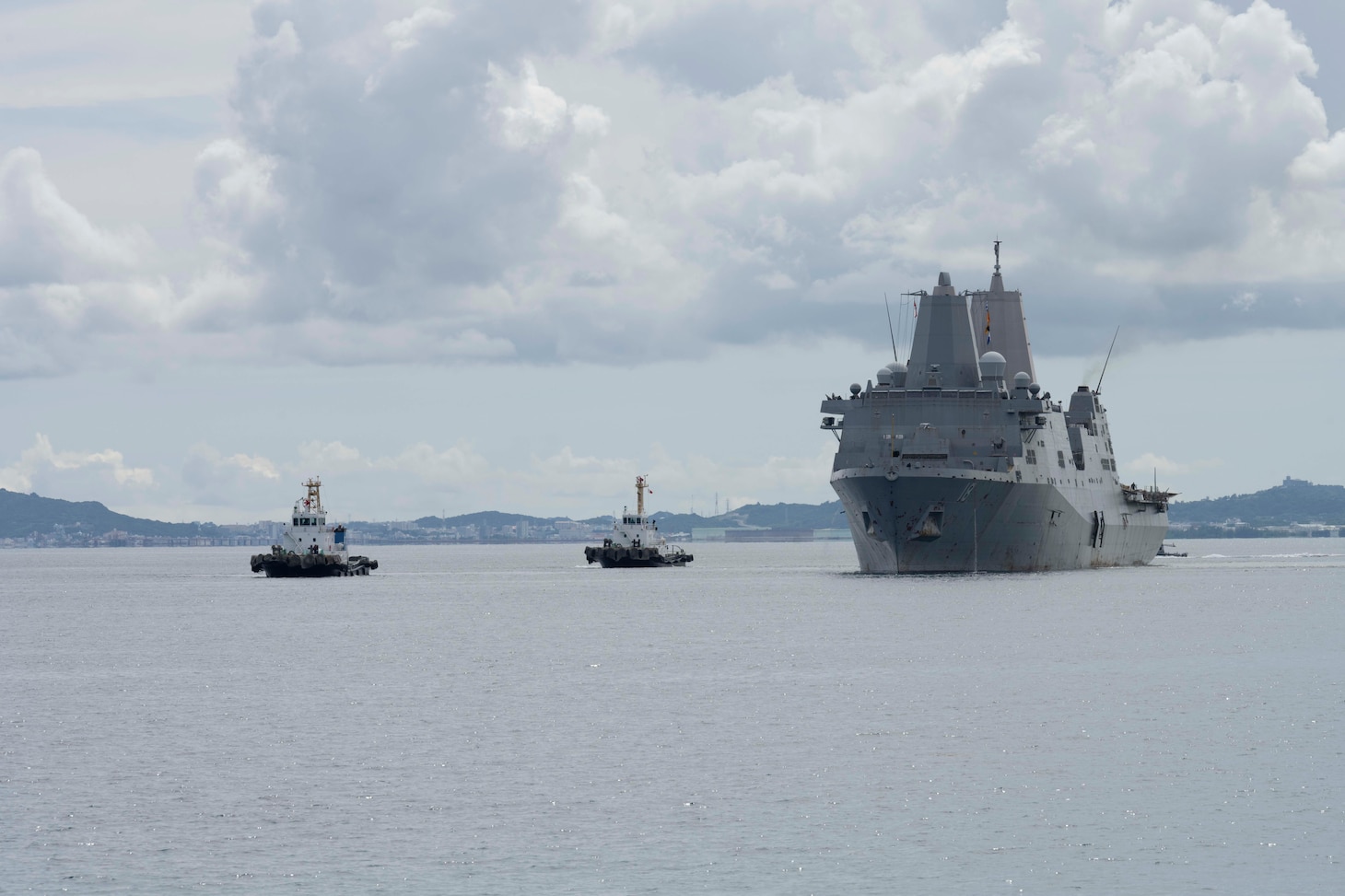 The San Antonio-class amphibious transport dock ship USS New Orleans (LPD) returns under its own propulsion to White Beach Naval Facility, Okinawa, Japan, Aug. 22, after the crew extinguished a fire aboard the ship. U.S. 7th Fleet is the U.S. Navy's largest forward-deployed numbered fleet, and routinely interacts and operates with allies and partners in preserving a free and open Indo-Pacific region. (U.S. Navy photo by Mass Communication Specialist 2nd Class Zack Guth)