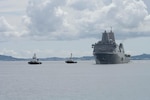 The San Antonio-class amphibious transport dock ship USS New Orleans (LPD) returns under its own propulsion to White Beach Naval Facility, Okinawa, Japan, Aug. 22, after the crew extinguished a fire aboard the ship. U.S. 7th Fleet is the U.S. Navy's largest forward-deployed numbered fleet, and routinely interacts and operates with allies and partners in preserving a free and open Indo-Pacific region. (U.S. Navy photo by Mass Communication Specialist 2nd Class Zack Guth)