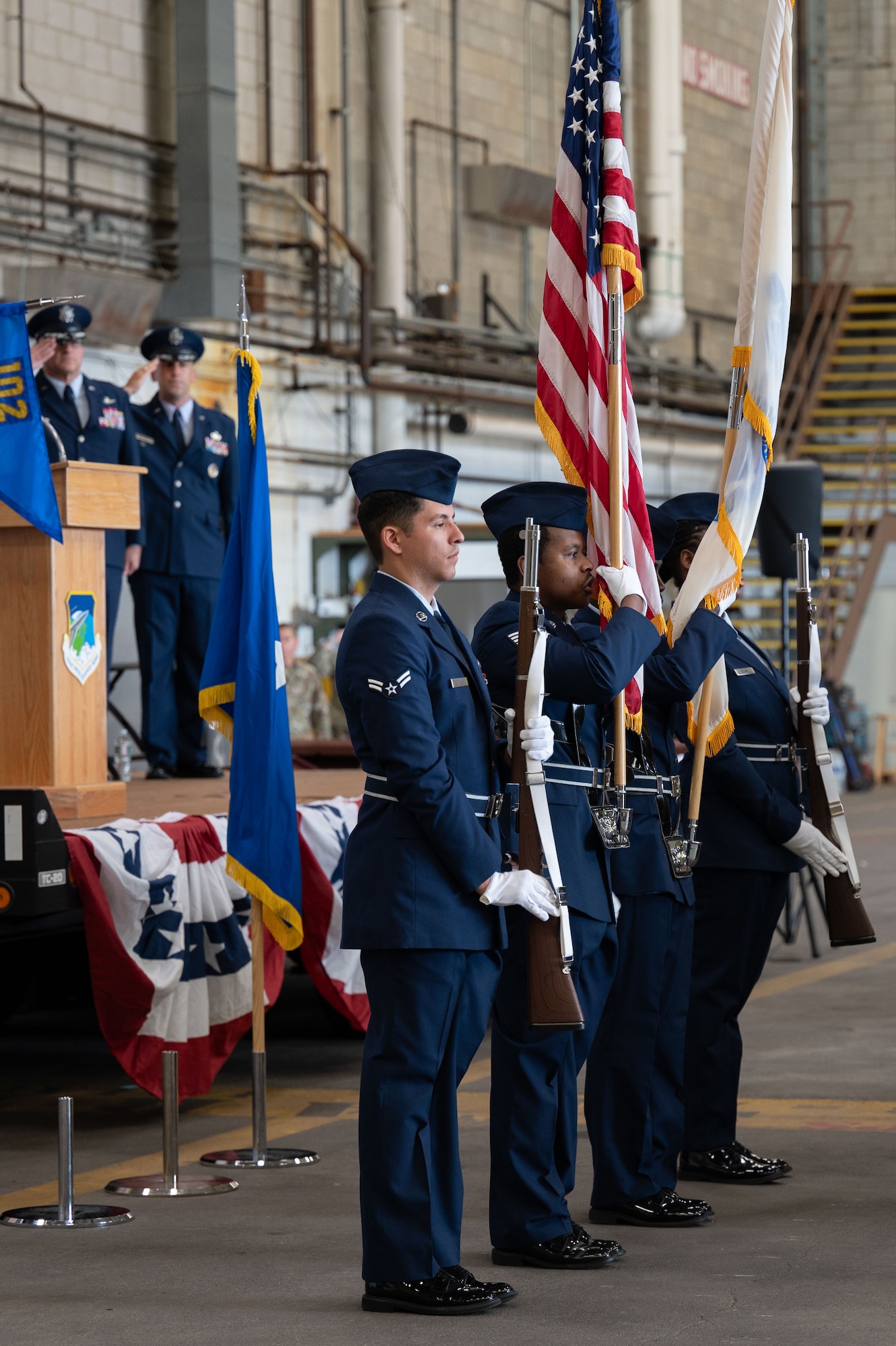 Honor guard presents the flags.