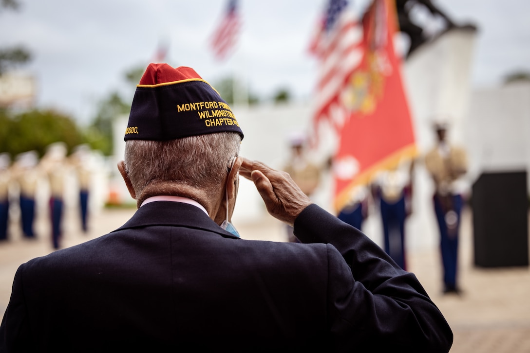 A U.S. Marine (retired) with the Montford Point Marine Association salutes the flag during the 16th Annual Montford Point Marines Day Ceremony at the Montford Point Marine Memorial in Jacksonville, North Carolina, Aug. 22, 2025. The annual ceremony honors the first African Americans to serve in the United States Marine Corps, recognizing their remarkable contributions, sacrifices and steadfast commitment to our nation. (U.S. Marine Corps photo by Sgt. Yvonna Guyette)