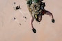 A U.S. Air Force pararescueman, 52nd Expeditionary Rescue Squadron jump master, performs a military free fall in the U.S. Central Command area of responsibility, Aug. 5, 2025. The ongoing training efforts of the 52 ERQS reflect the Air Force's commitment to excellence in rescue operations and regional stability across the CENTCOM region. (U.S. Air Force photo by Senior Airman Natalie Jones)
