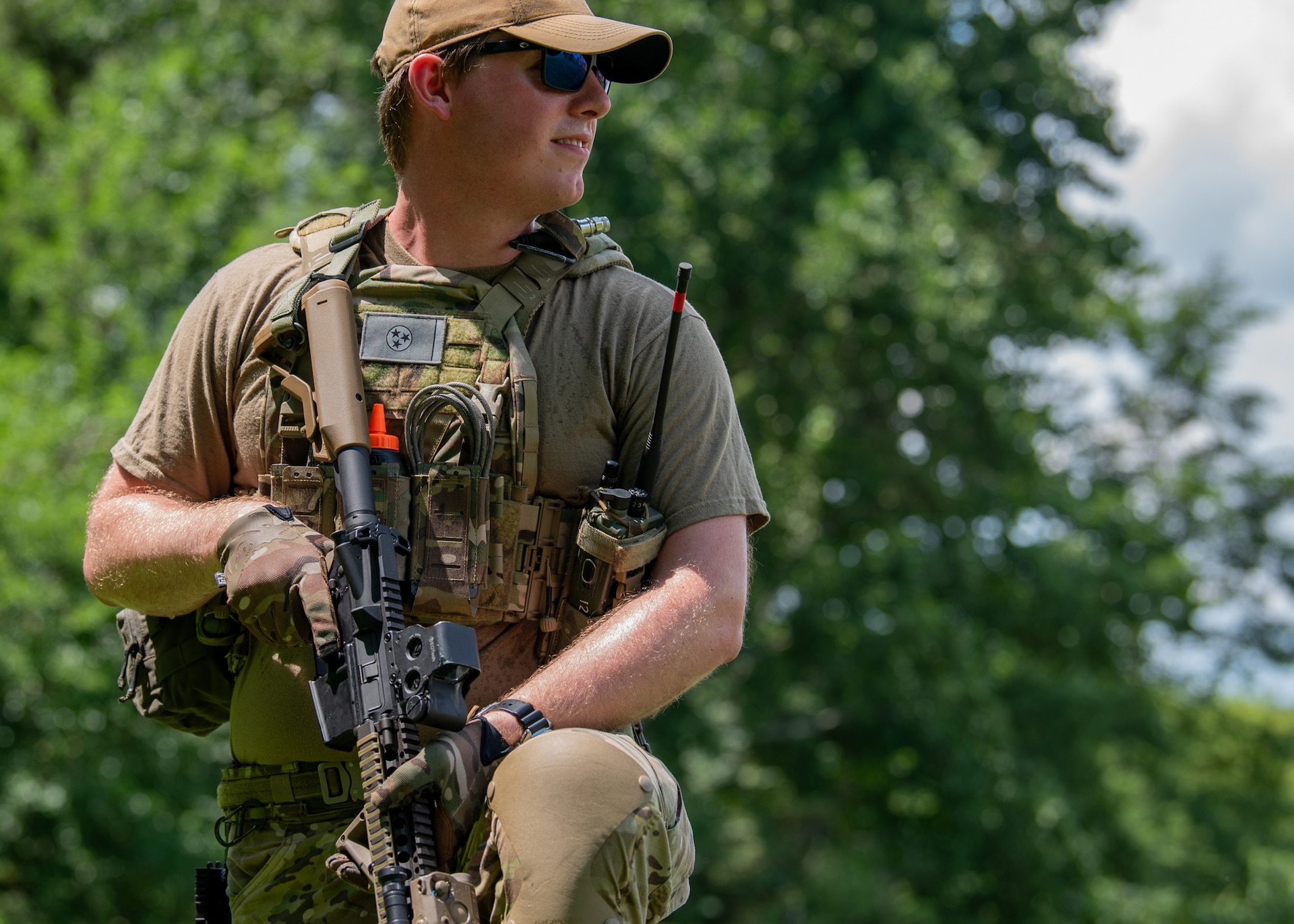 Airman 1st Class William Darlington, a member of the Kentucky Air National Guard’s 123rd Explosive Ordnance Disposal Flight, stands guard during a training exercise at Muscatatuck Urban Training Center in Butlerville, Indiana, July 26, 2025.