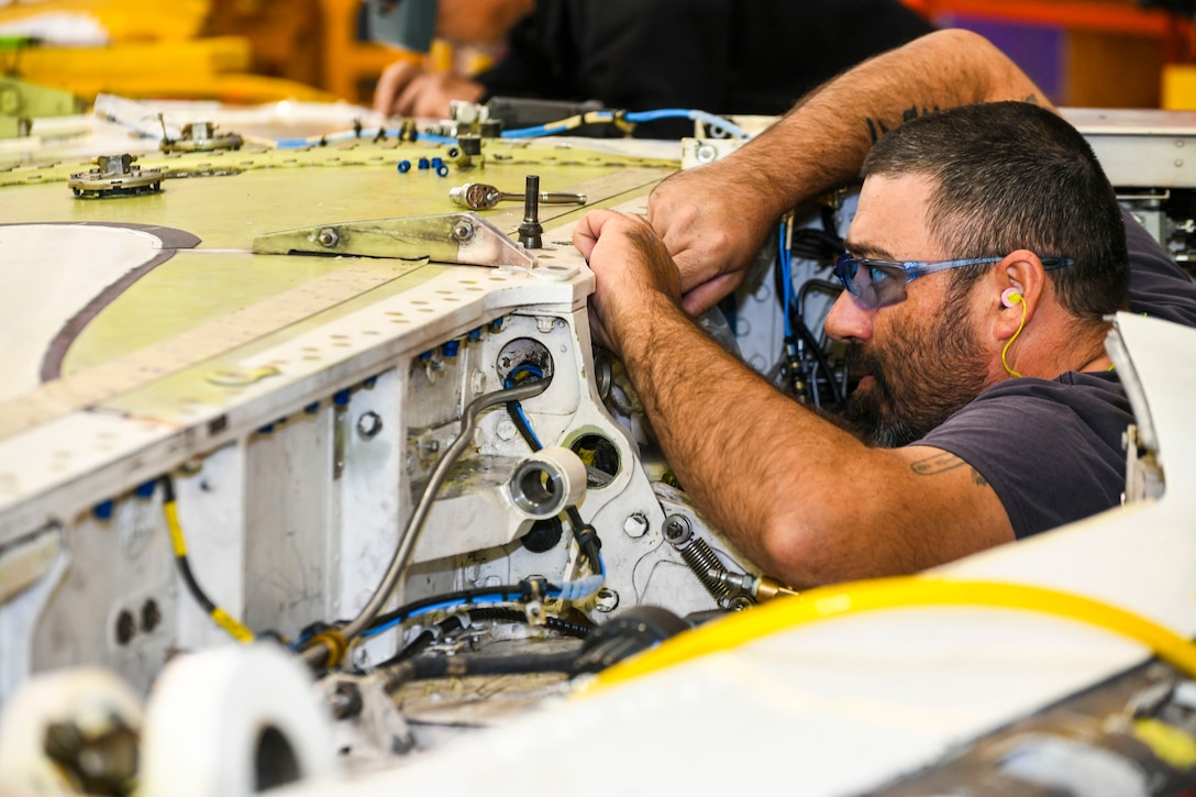 250327-N-DG679-1041
Kristopher Williams, a sheet metal mechanic at Fleet Readiness Center Southeast (FRCSE), performs an accessory change on a T-45 Goshawk forward wing spar. The T-45 jet aircraft is used for intermediate and advanced portions of the Navy/Marine Corps pilot training program. (U.S. Navy photo by Toiete Jackson)