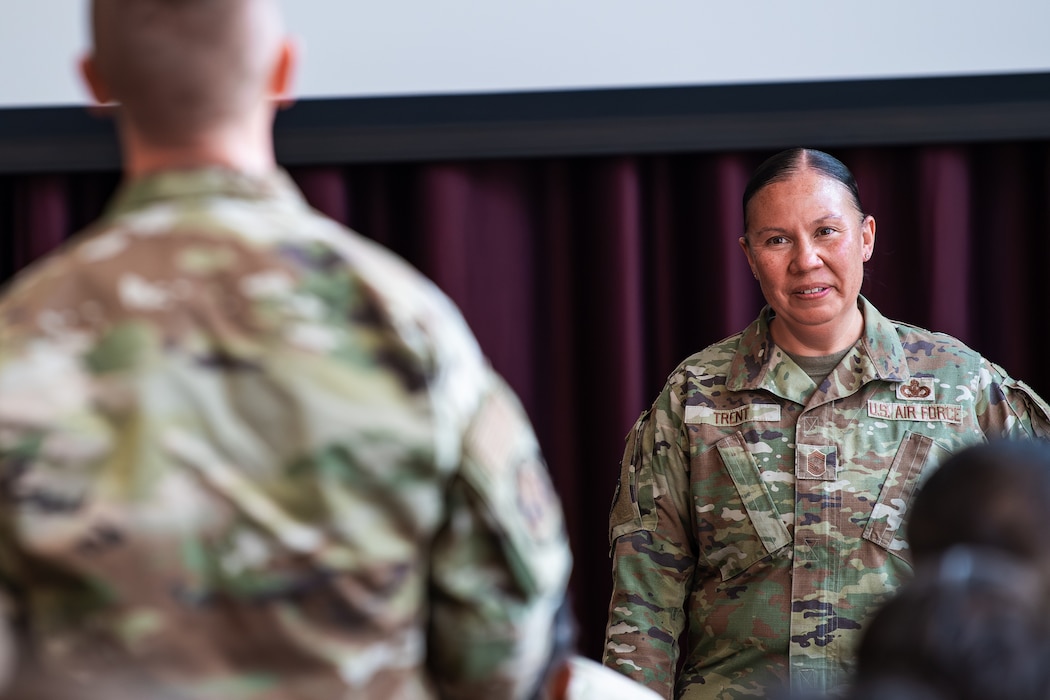 An Air Force command chief speaks with an Airman