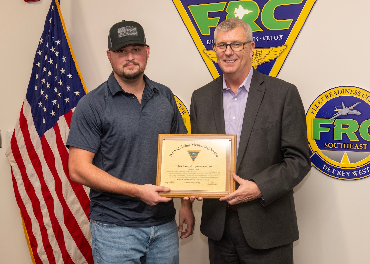 JACKSONVILLE, Fla. – Tim Pfannenstein, Fleet Readiness Center Southeast’s (FRCSE) executive director, presents Nicholas Yoder, a lead industrial engineering technician, with the Dora Quinlan Mentor of the Year award for providing outstanding mentorship to the workforce.