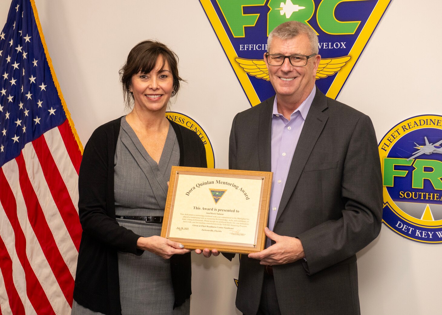250128-N-BK290-1025
JACKSONVILLE, Fla. – Tim Pfannenstein, Fleet Readiness Center Southeast’s (FRCSE) executive director, presents AnnMarie Salazar, the Training Department supervisor, with the Dora Quinlan Mentor of the Year award for providing outstanding mentorship to the workforce.