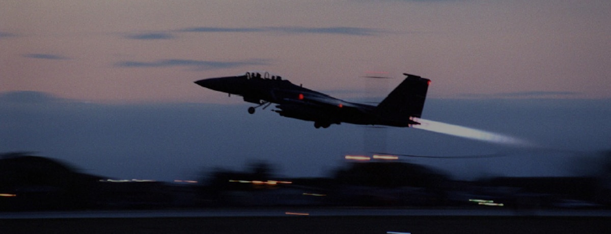 Image of F-15 Eagle taking off from an airfield during the Balkans Conflict.
