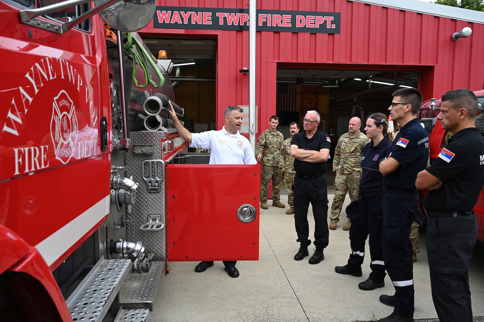 Chris Wysong, chief of Wayne Township Fire Department, gives a tour Aug. 22 to a delegation of four firefighters from the Serbian Volunteer Fire Department.