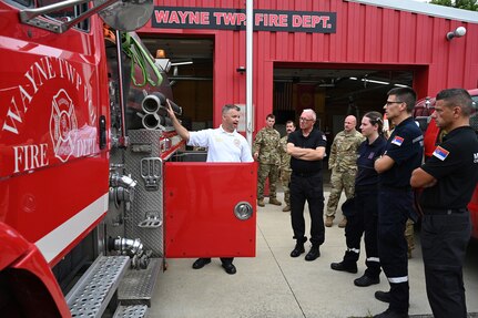 Chris Wysong, chief of Wayne Township Fire Department, gives a tour Aug. 22 to a delegation of four firefighters from the Serbian Volunteer Fire Department.
