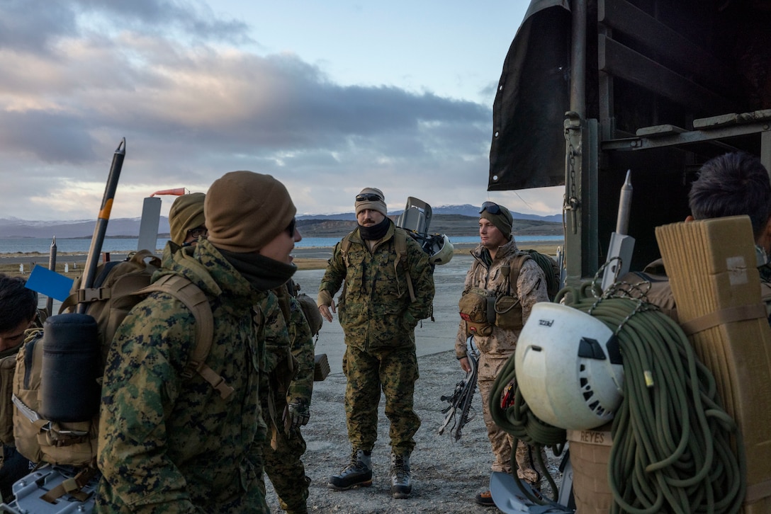 U.S. Marines with the Mountain Warfare Training Center and  8th Engineer Support Battalion, 2nd Marine Logistics Group, load into tactical vehicles to move to a training area in Ushuaia, Argentina, Aug. 12, 2025. This training creates opportunities for continued combined exercises with Argentine forces which aim to build upon the skills learned in these knowledge exchanges. (U.S. Marine Corps photo by Lance Cpl. Payton Goodrich)