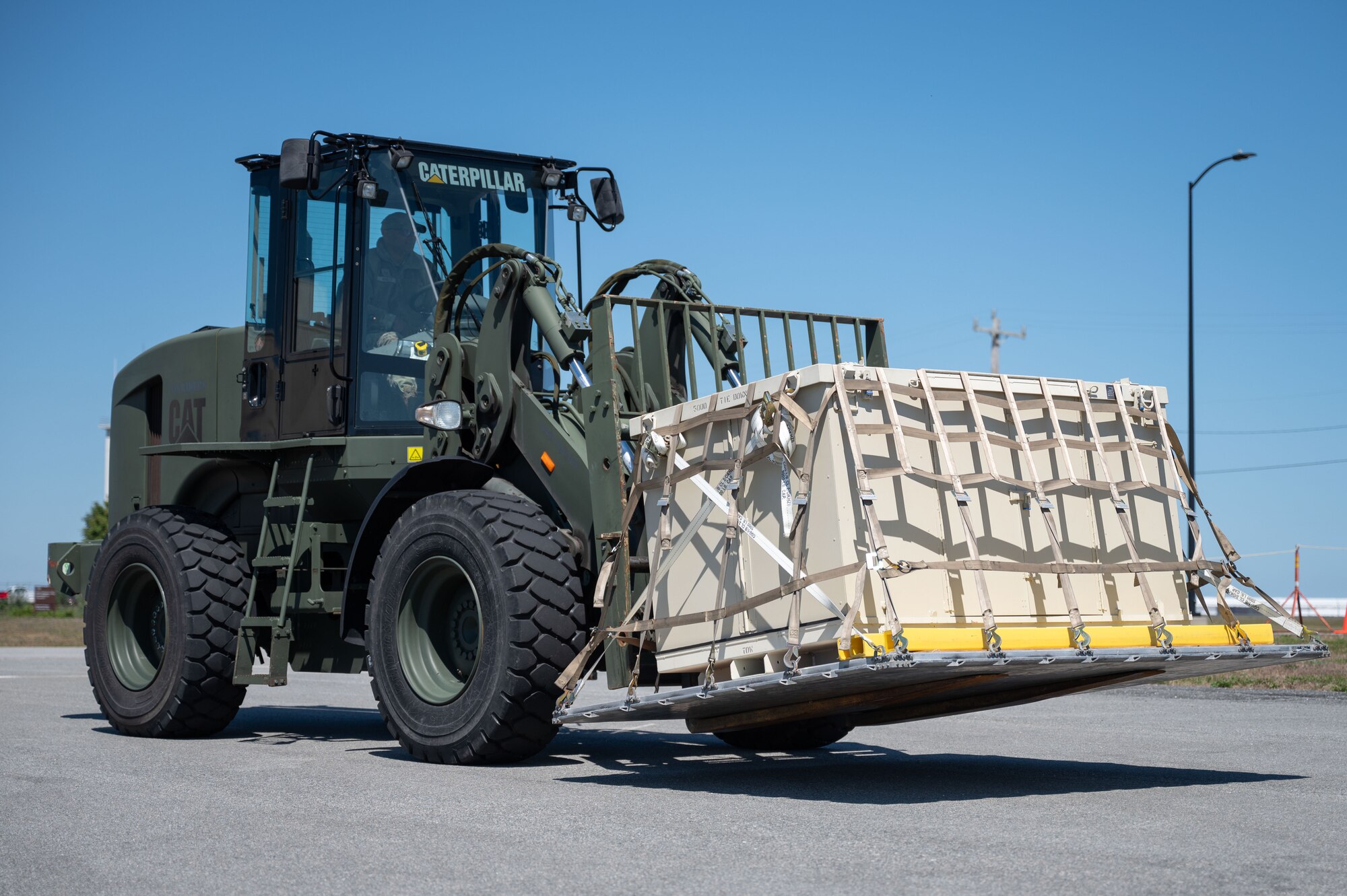 Airman drives a forklift.