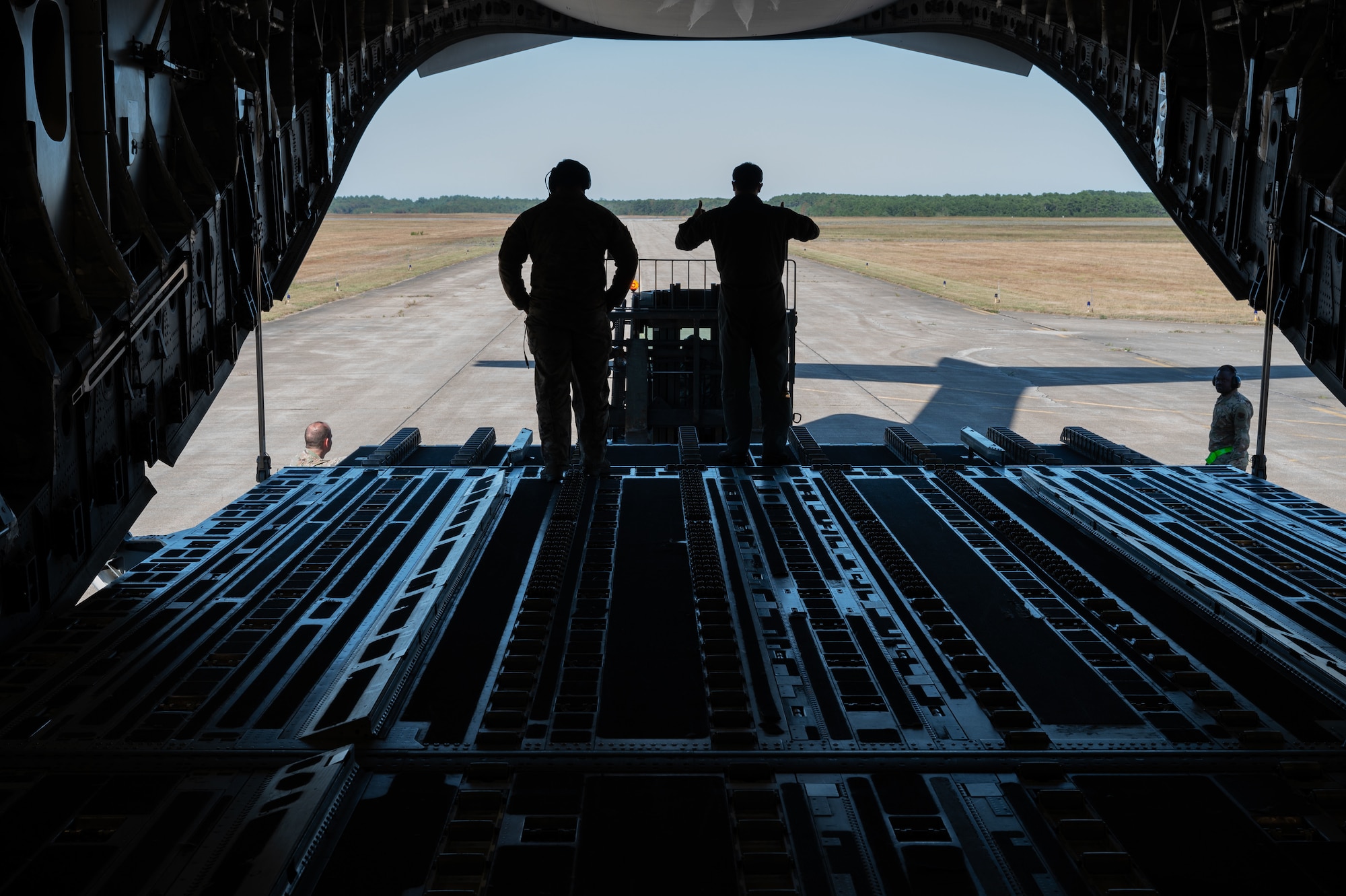 Airman loads cargo into aircraft.