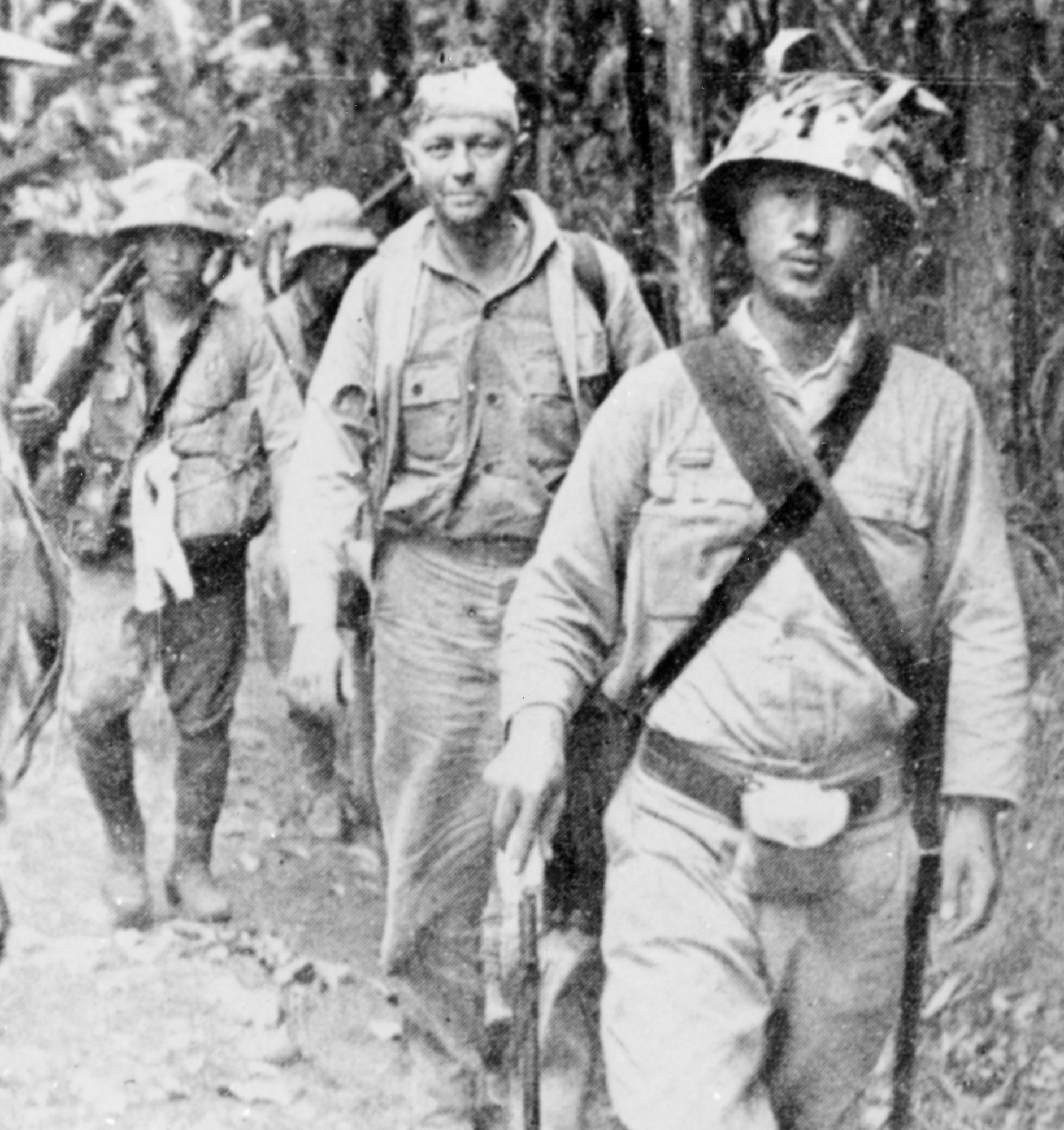 A row of servicemen walking