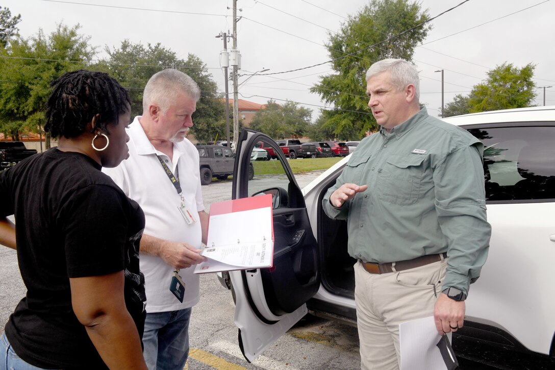 Michael Vance, a logistics management specialist with the U.S. Army Corps of Engineers Logistics Activity Assessment Branch, and Brittany Wallace, a logistics management specialist with the USACE Savannah District, conduct a government vehicle inspection at the Savannah District’s Hunter Army Airfield Resident Office with Resident Engineer Todd McGalliard.
As part of the Command Logistics Review Program, Vance visited the district with a five-person team to assess logistic readiness and provide actionable guidance. The team conducted its initial assessment in April; this visit was an in-person follow-up.