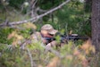 An Airman from the Kentucky Air National Guard’s 123rd Contingency Response Group lays prone to fortify a defensive position at the Alpena Combat Readiness Training Center in Alpena, Michigan, May 24, 2025.
