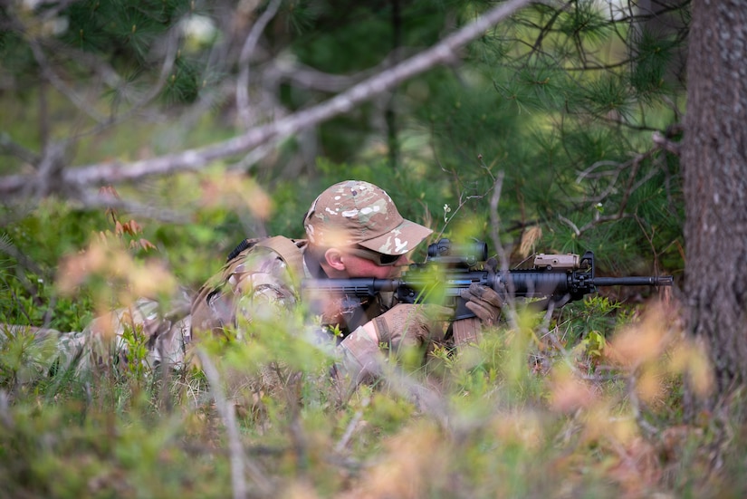 An Airman from the Kentucky Air National Guard’s 123rd Contingency Response Group lays prone to fortify a defensive position at the Alpena Combat Readiness Training Center in Alpena, Michigan, May 24, 2025.