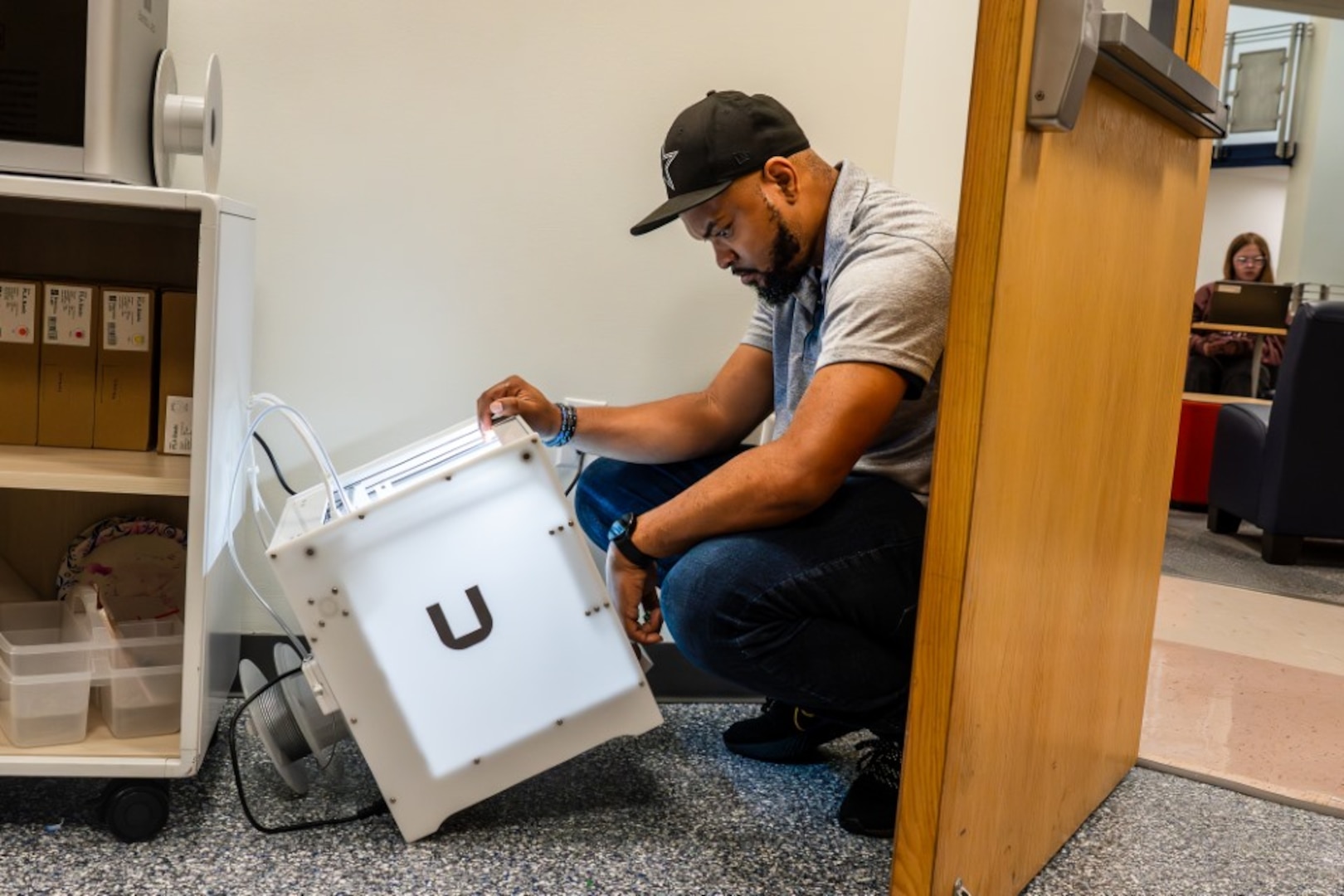 STAFFORD, Va. – Naval Surface Warfare Center Dahlgren Division (NSWCDD) IT specialist Eric Hayes sets up a 3D printer at the Academy of Technology and Innovation at the University of Mary Washington. NSWCDD donated 3D printers, a resin printer and 3D scanner materials to support the program’s students.
