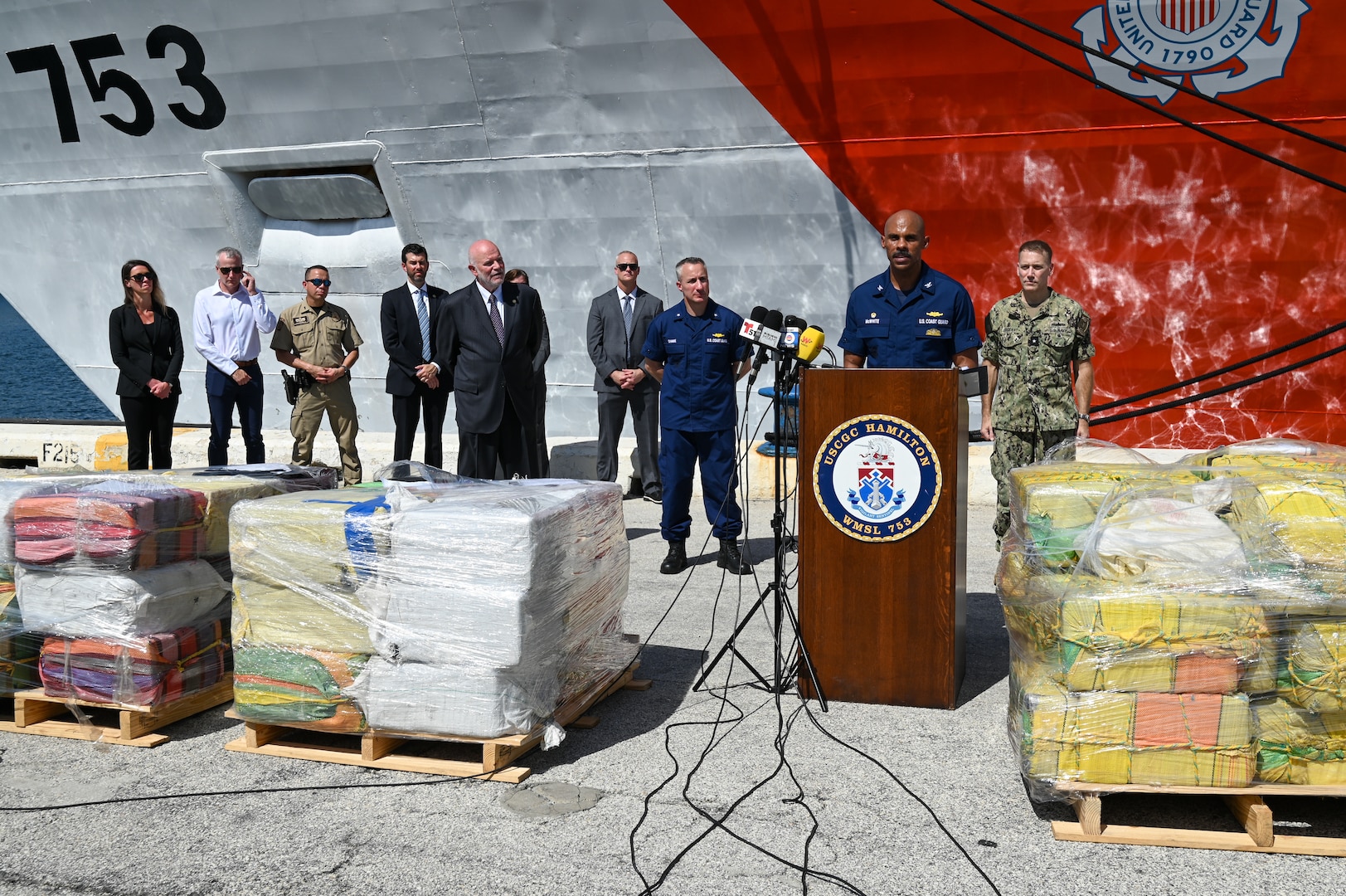 U.S. Coast Guard Capt. John McWhite, commanding officer of the Coast Guard Cutter Hamilton (WMSL 753), speaking at press conference for an offload of 76,140 lbs of illicit narcotics at Port Everglades, Florida, on August 25, 2025. This was the single largest offload in the Coast Guard's history. (U.S. Coast Guard Petty Officer 3rd Class Nicholas Strasburg)