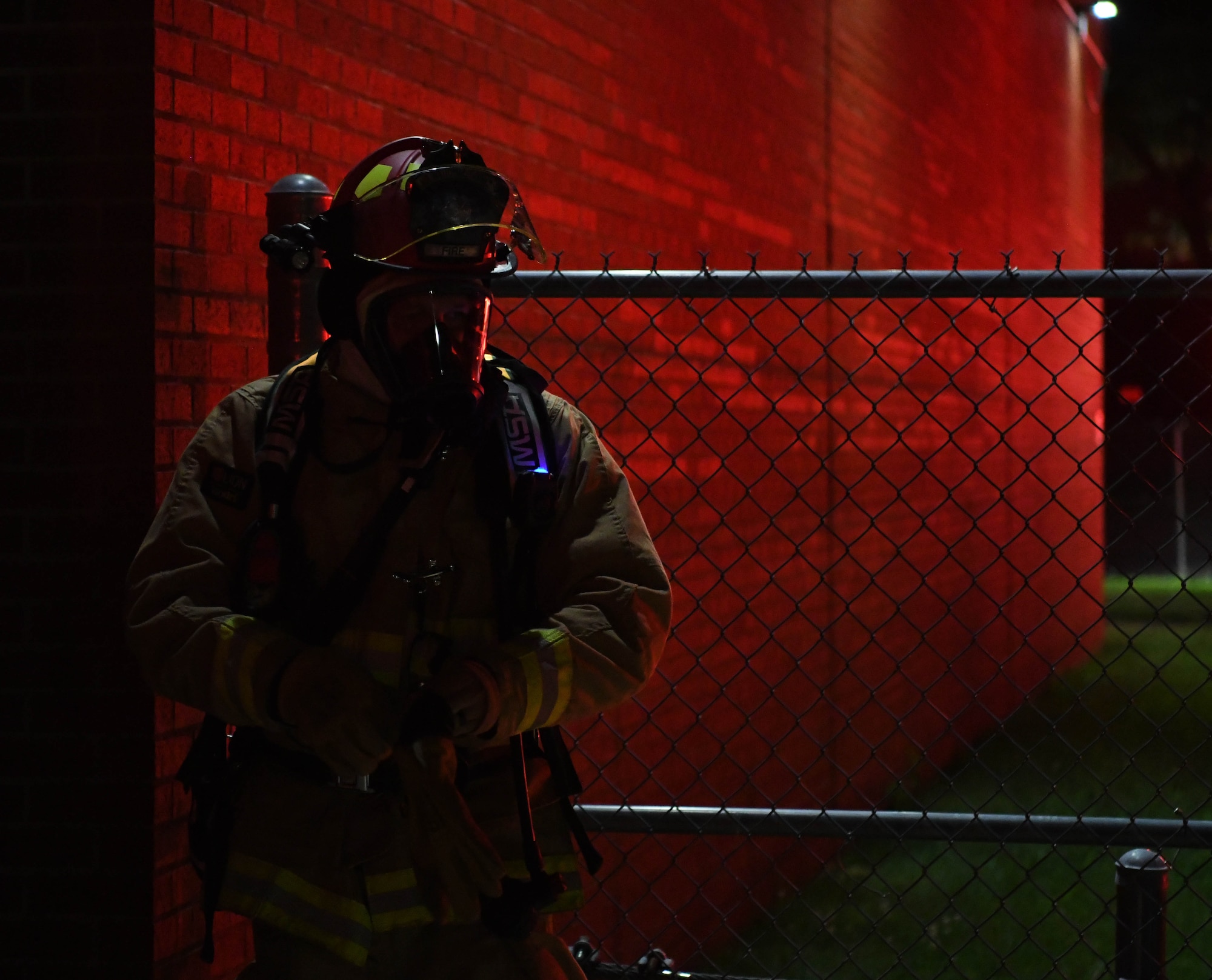 A U.S. Air Force fire protection specialist assigned to the 178th Civil Engineering Squadron, helps evacuate a building July 14, 2025 at Springfield-Beckley Air National Guard Base, Ohio. The exercise provided hands-on experience in firefighting techniques, enhancing the team's readiness to respond to real-world emergencies in deployed environments. (U.S. Air National Guard photo by Airman 1st Class Josh Kaeser)