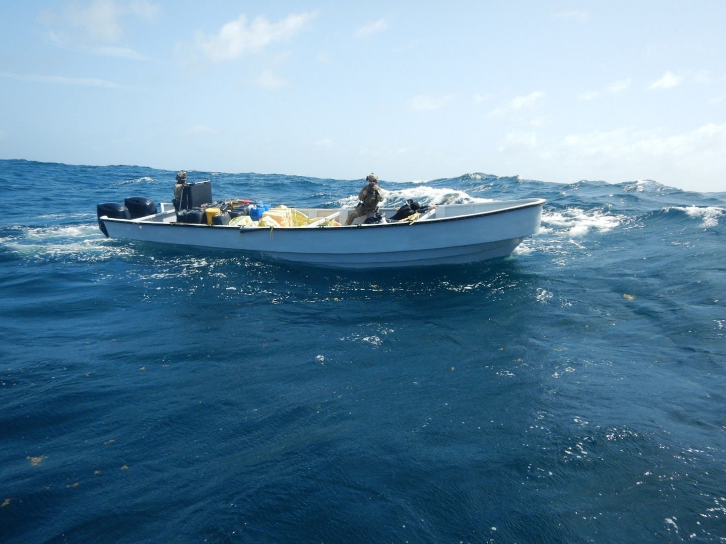 U.S. Coast Guard Law Enforcement Detachment 408 crew interdicts a suspicious vessel approximately 87 miles north of Bonaire, June 30, 2025. The crew of USS Cole (DDG 67) provided support during the interdiction, resulting in the seizure of approximately 2,425 pounds of cocaine. (U.S. Coast Guard photo)