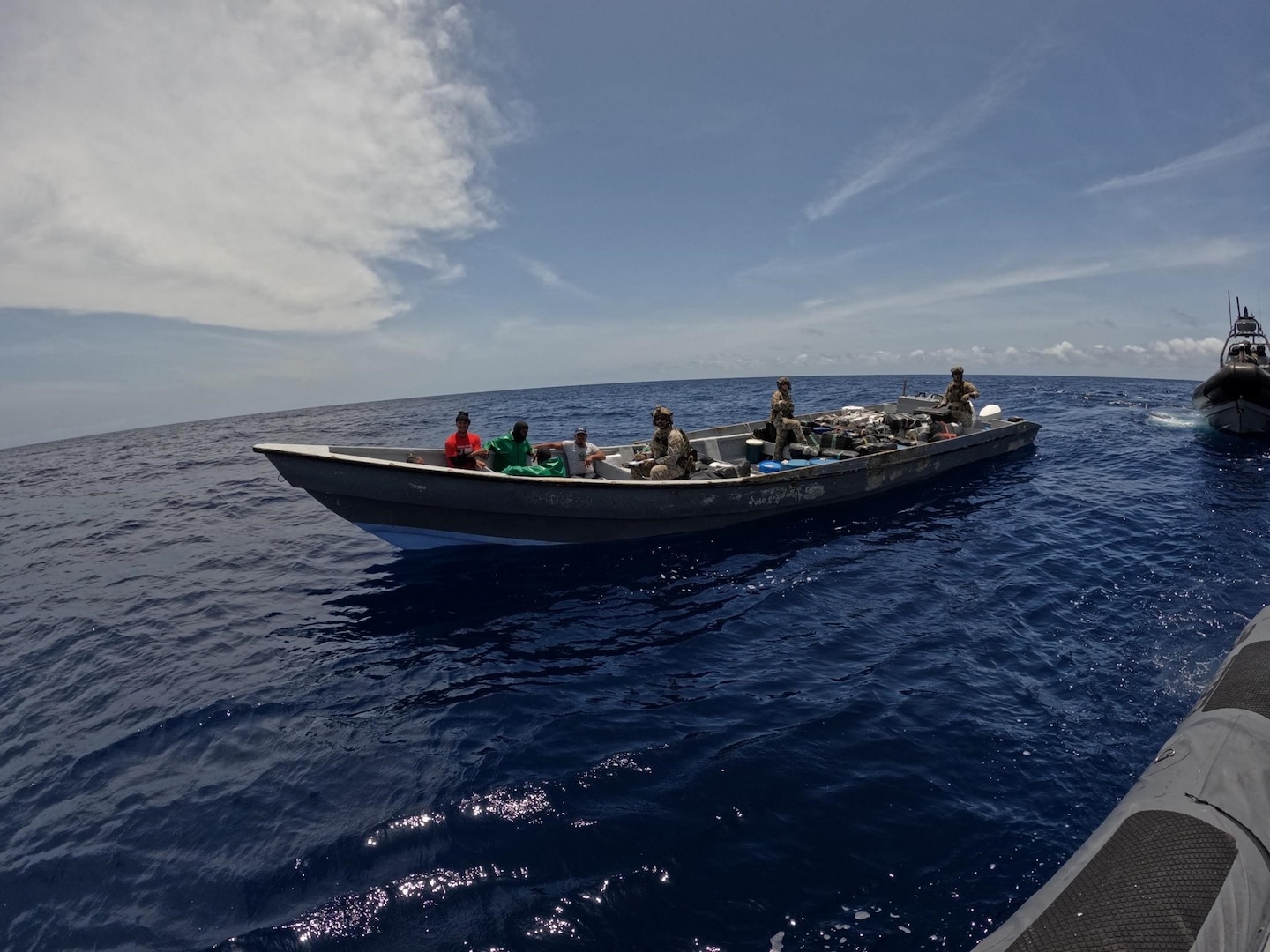 U.S. Coast Guard Law Enforcement Detachment 404 crew interdicts a suspicious vessel approximately 17 miles northeast of Silva, Venezuela, July 11, 2025. The crew of HNLMS Friesland (P-842) provided support during the interdiction, resulting in the seizure of approximately 9,088 pounds of marijuana. (U.S. Coast Guard photo)