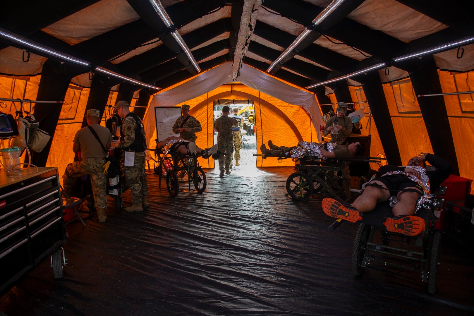 “Disaster victims” are medically treated after being rescued from a simulated explosion during a CERFP (CBRNE (Chemical, Biological, Radiological, Nuclear, and Explosive) Enhanced Response Force Package) training exercise at Camp Rilea, Warrenton, Oregon on August 14, 2025.