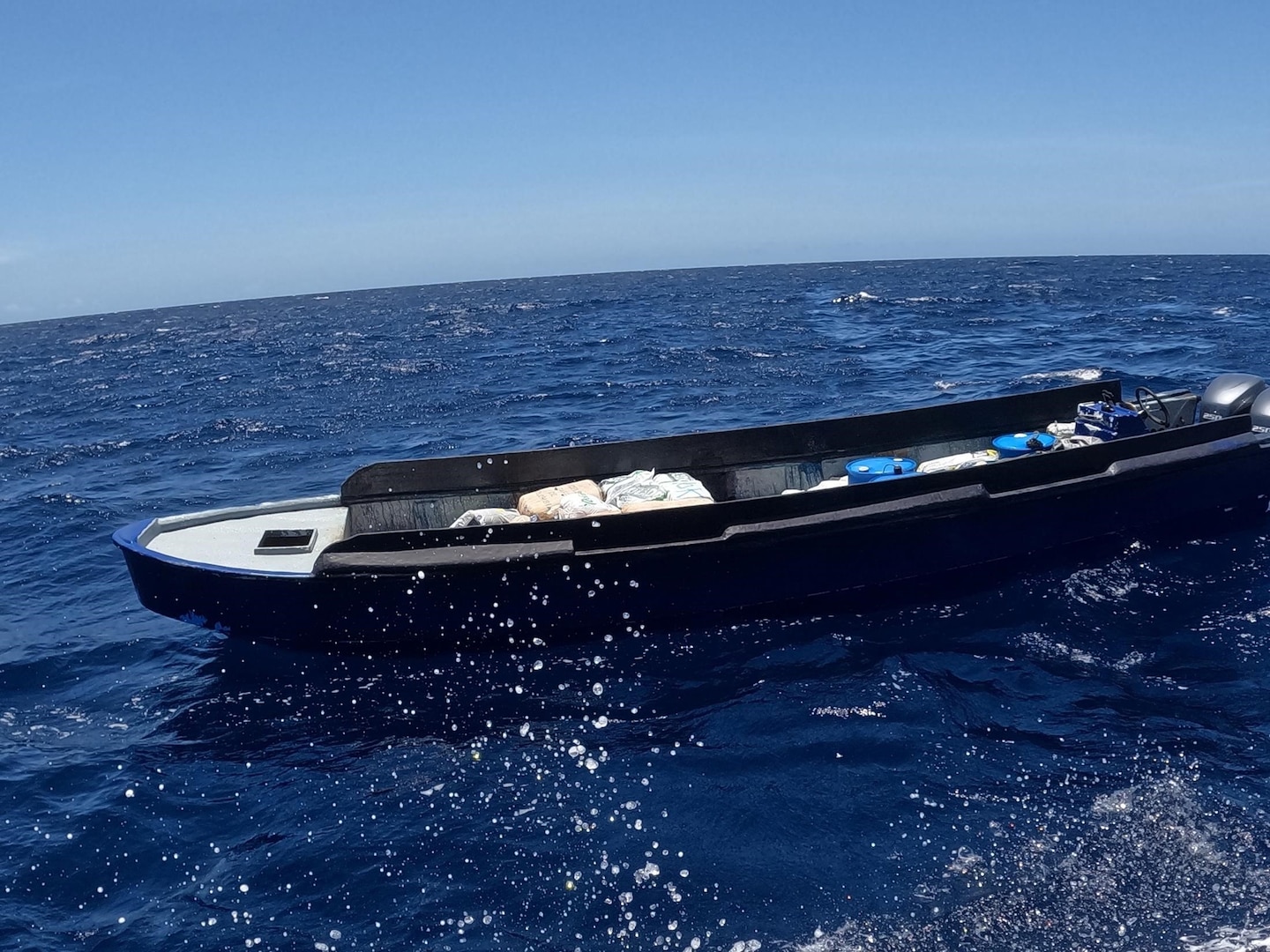 U.S. Coast Guard Law Enforcement Detachment 404 crew interdicts a suspicious vessel approximately 52 miles north of Carabobo, Venezuela, Aug. 2, 2025. The crew of HNLMS Friesland (P-842) and an embarked Helicopter Interdiction Tactical Squadron (HITRON) aircrew provided tactical support during the interdiction, resulting in the seizure of 3,618 pounds of marijuana. (U.S. Coast Guard photo)