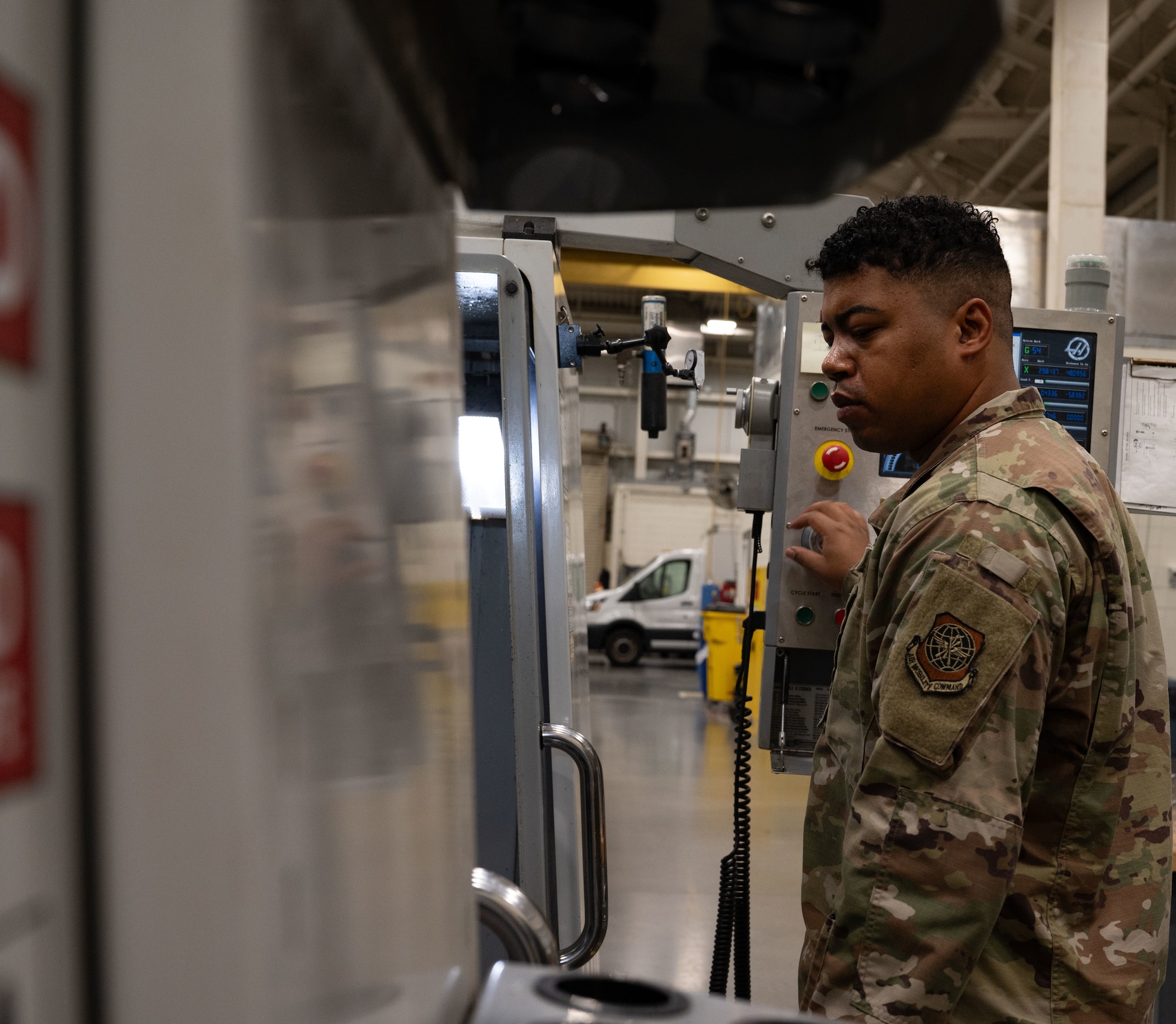 U.S. Air Force Tech. Sgt. Dontie Custis, 305th Maintenance Squadron Aircraft Metals Technology noncommissioned officer in charge, monitors the Computer Numeric Control machine at Joint Base McGuire-Dix-Lakehurst, N.J., Aug. 20, 2025. The CNC machine manufactured the Aileron C-channels needed to fix the KC-46A Pegasus at JB MDL. (U.S. Air Force photo by Airman Haeleigh Bayle)