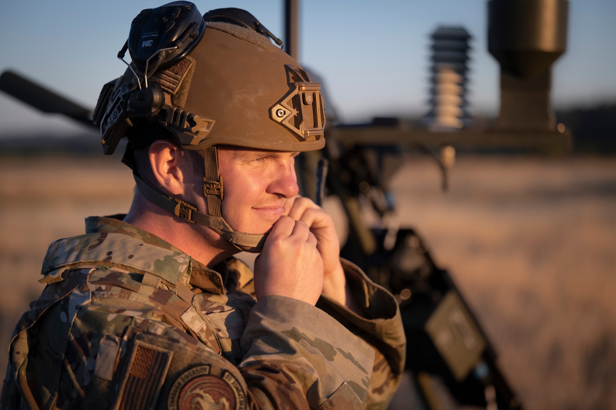 Airman puts on helmet