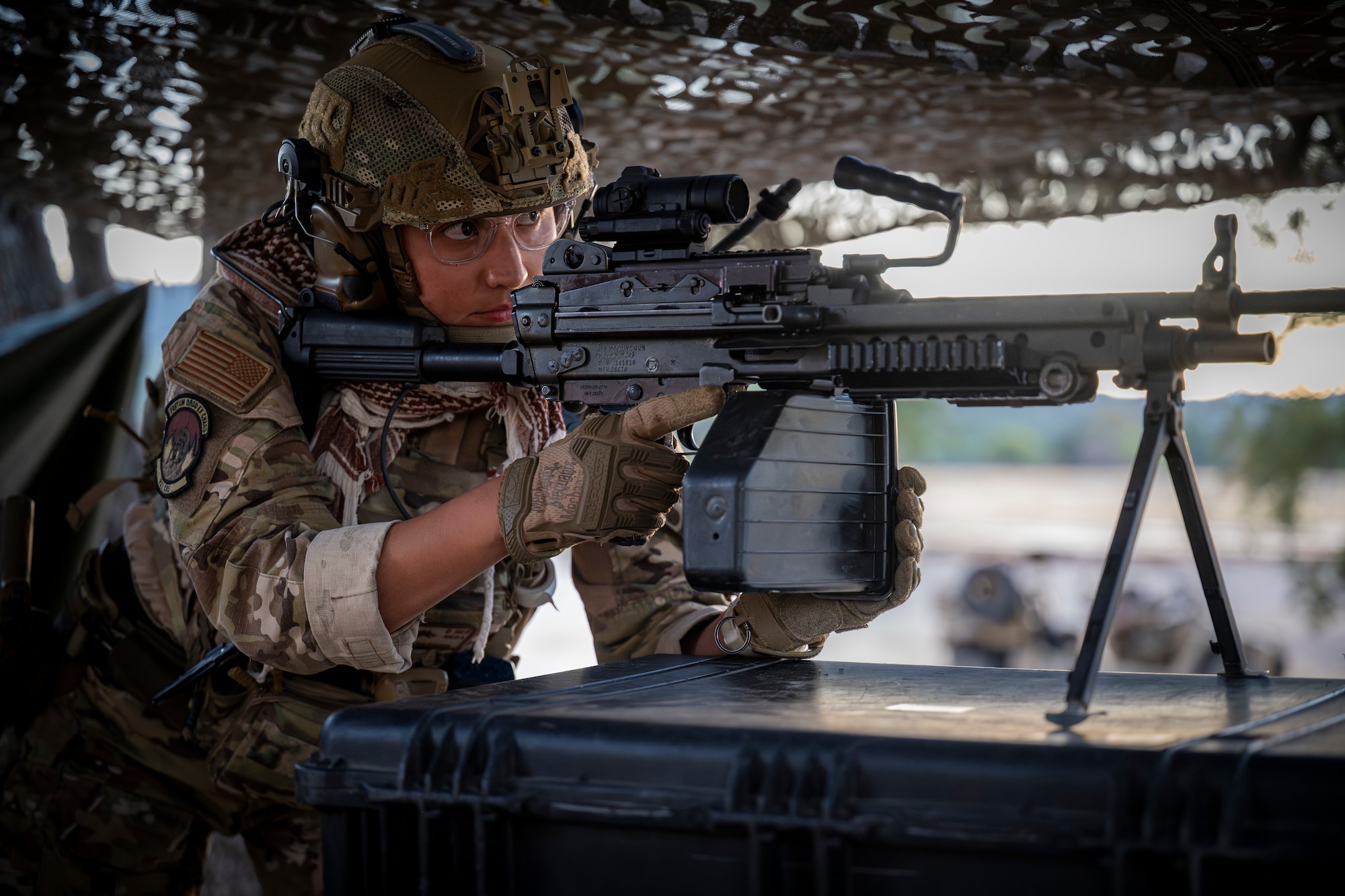 Airman aims down her scope