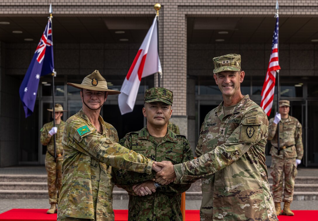 U.S. Army Soldiers from U.S. Army Pacific (USARPAC), 1st (Australian) Division Soldiers, and the Japan Ground Self-Defense Force (JGSDF) members salute their national colors during the opening ceremony of Exercise Yama Sakura 89 on JGSDF Camp Itami, Japan, Aug. 25, 2025.