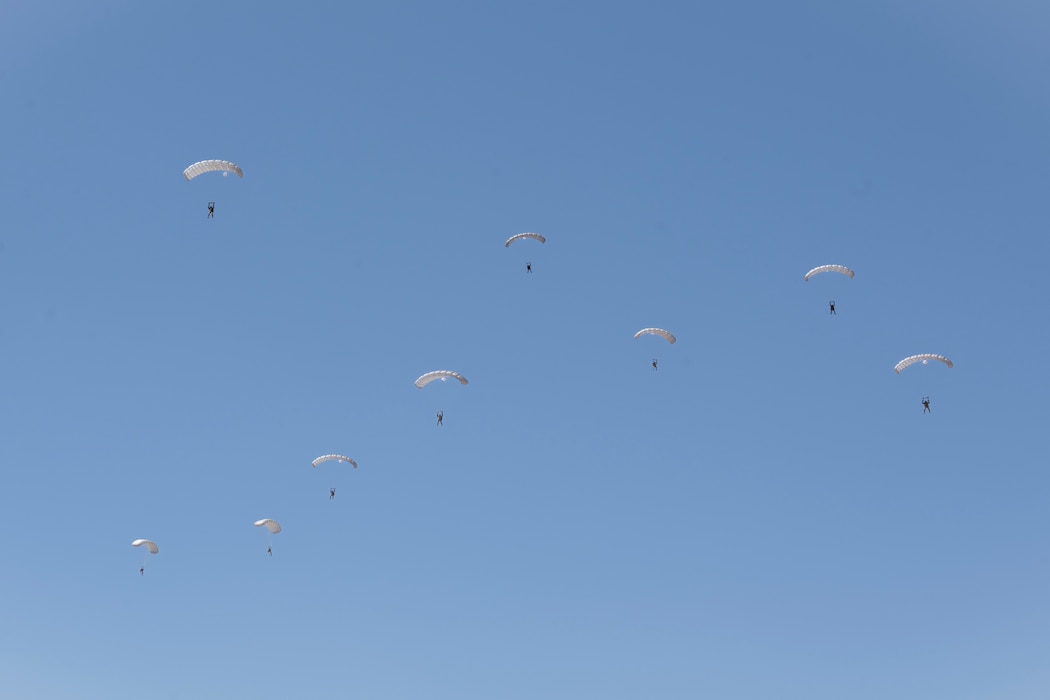 Pararescuemen parachute down to earth