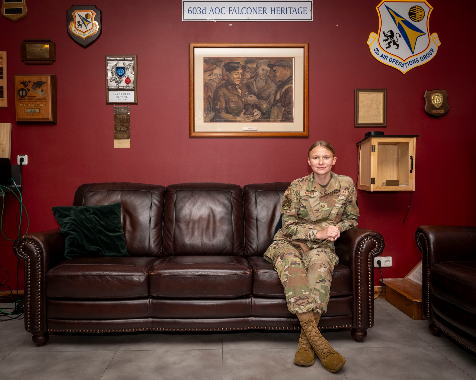 Staff Sgt. Eleanor Warren sits on a couch for a photo.