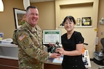 Registered Nurse Susan Kaurudar receives the CRDAMC inpatient DAISY award.