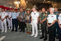 Front row, from right to left, Canadian Chief of Defense Staff Gen. Jennie Carignan, Commander of the Indonesian National Armed Forces Gen. Agus Subiyanto, and Adm. Samuel J. Paparo, commander of U.S. Indo-Pacific Command, participate in a ceremony aboard the Japan Maritime Self Defense Force Amphibious Landing Ship JS Osumi (LST 4001) in Jakarta, Indonesia, Aug. 24, 2025.