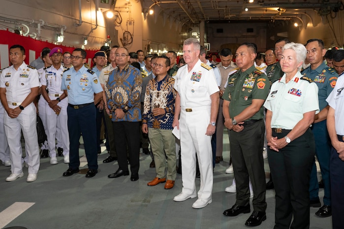 Front row, from right to left, Canadian Chief of Defense Staff Gen. Jennie Carignan, Commander of the Indonesian National Armed Forces Gen. Agus Subiyanto, and Adm. Samuel J. Paparo, commander of U.S. Indo-Pacific Command, participate in a ceremony aboard the Japan Maritime Self Defense Force Amphibious Landing Ship JS Osumi (LST 4001) in Jakarta, Indonesia, Aug. 24, 2025.