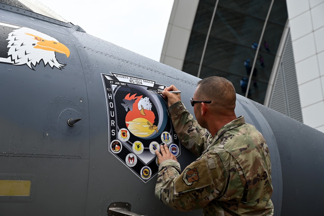 Person signs aircraft
