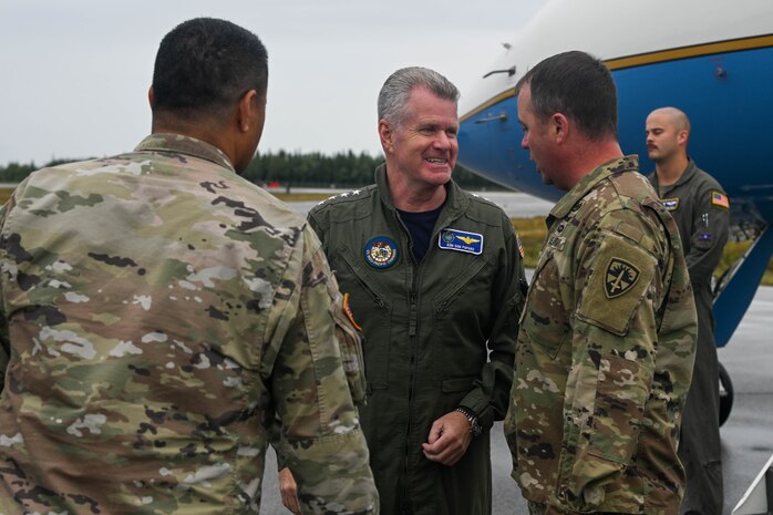 U.S. Navy Adm. Samuel J. Paparo, Commander, U.S. Indo-Pacific Command, greets base leaders after arriving at Fort Greely, Alaska, Aug. 19, 2025, during exercise Northern Edge 2025. NE25 is an exercise led by U.S. Indo-Pacific Command that serves as a platform for joint, multi-domain operations to deliver high-end, realistic warfighter training, strengthen joint interoperability, and sharpen the air and sea-based combat readiness of U.S. and participating forces. (U.S. Air Force photo by Airman 1st Class Spencer Hanson)