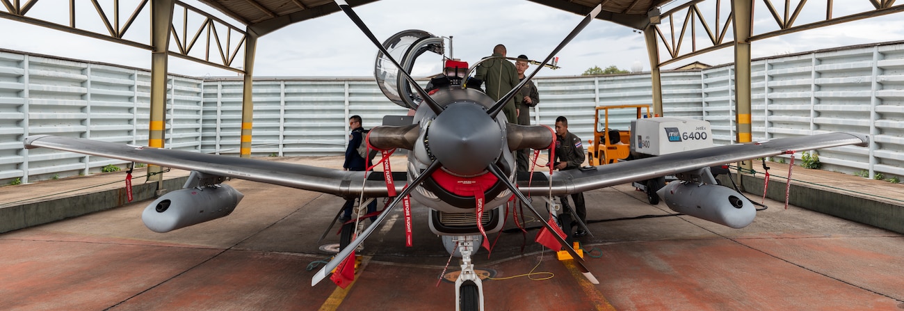Royal Thai Air Force Airmen prepare an orientation of their AT-6 aircraft for U.S. Air Force Weapons Systems Officers during Enduring Partners on August 18, 2025 at Korat Royal Thai Air Force Base, Thailand. Enduring Partners is an exchange designed to bolster interoperability and partnership, and is part of the National Guard-sponsored State Partnership Program which formally began between the Royal Thai Armed Forces and the Washington National Guard in 2002.