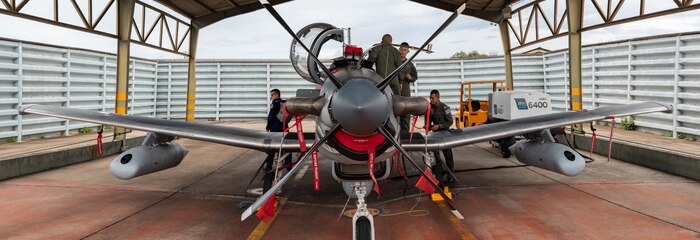 Royal Thai Air Force Airmen prepare an orientation of their AT-6 aircraft for U.S. Air Force Weapons Systems Officers during Enduring Partners on August 18, 2025 at Korat Royal Thai Air Force Base, Thailand. Enduring Partners is an exchange designed to bolster interoperability and partnership, and is part of the National Guard-sponsored State Partnership Program which formally began between the Royal Thai Armed Forces and the Washington National Guard in 2002.
