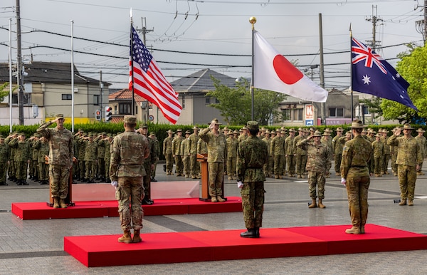 U.S. Army Soldiers from U.S. Army Pacific (USARPAC), 1st (Australian) Division Soldiers, and the Japan Ground Self-Defense Force (JGSDF) members salute their national colors during the opening ceremony of Exercise Yama Sakura 89 on JGSDF Camp Itami, Japan, Aug. 25, 2025.