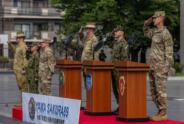 U.S. Army Soldiers from U.S. Army Pacific (USARPAC), 1st (Australian) Division Soldiers, and the Japan Ground Self-Defense Force (JGSDF) members salute their national colors during the opening ceremony of Exercise Yama Sakura 89 on JGSDF Camp Itami, Japan, Aug. 25, 2025.