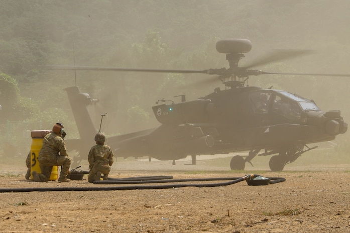 Sgt. Clayton Odneal and Pfc. Maddyson Woods, petroleum supply specialists assigned to 3rd Battalion, 2nd General Support Aviation Battalion, 2nd Combat Aviation Brigade, 2d Infantry Division/ROK-U.S. Combined Division, prepares for refueling operations of a AH-64 Apache during Ulchi Freedom Shield on Deju Island, South Korea, Aug. 21, 2025.