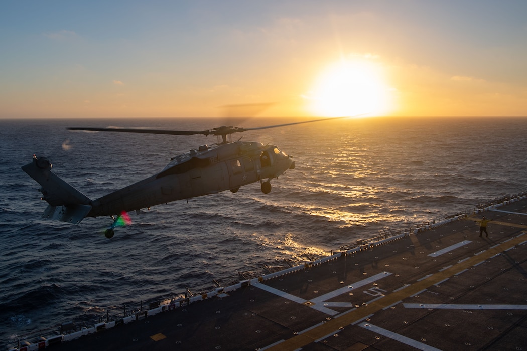 An MH-60S Sea Hawk helicopter assigned to the “Blackjacks” of Helicopter Sea Combat Squadron (HSC) 21, takes off from the flight deck aboard the Wasp-class amphibious assault ship USS Boxer (LHD 4) while conducting flight operations Aug. 19, 2025.