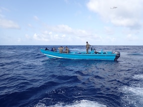 U.S. Coast Guard Law Enforcement Detachment 108 crew interdicts a suspicious vessel approximately 100 miles north of Aruba, Aug. 7, 2025. The crew of USS Minneapolis-Saint Paul (LCS 21) provided support during the interdiction, resulting in the seizure of approximately 2,701 pounds of cocaine. (U.S. Coast Guard photo)