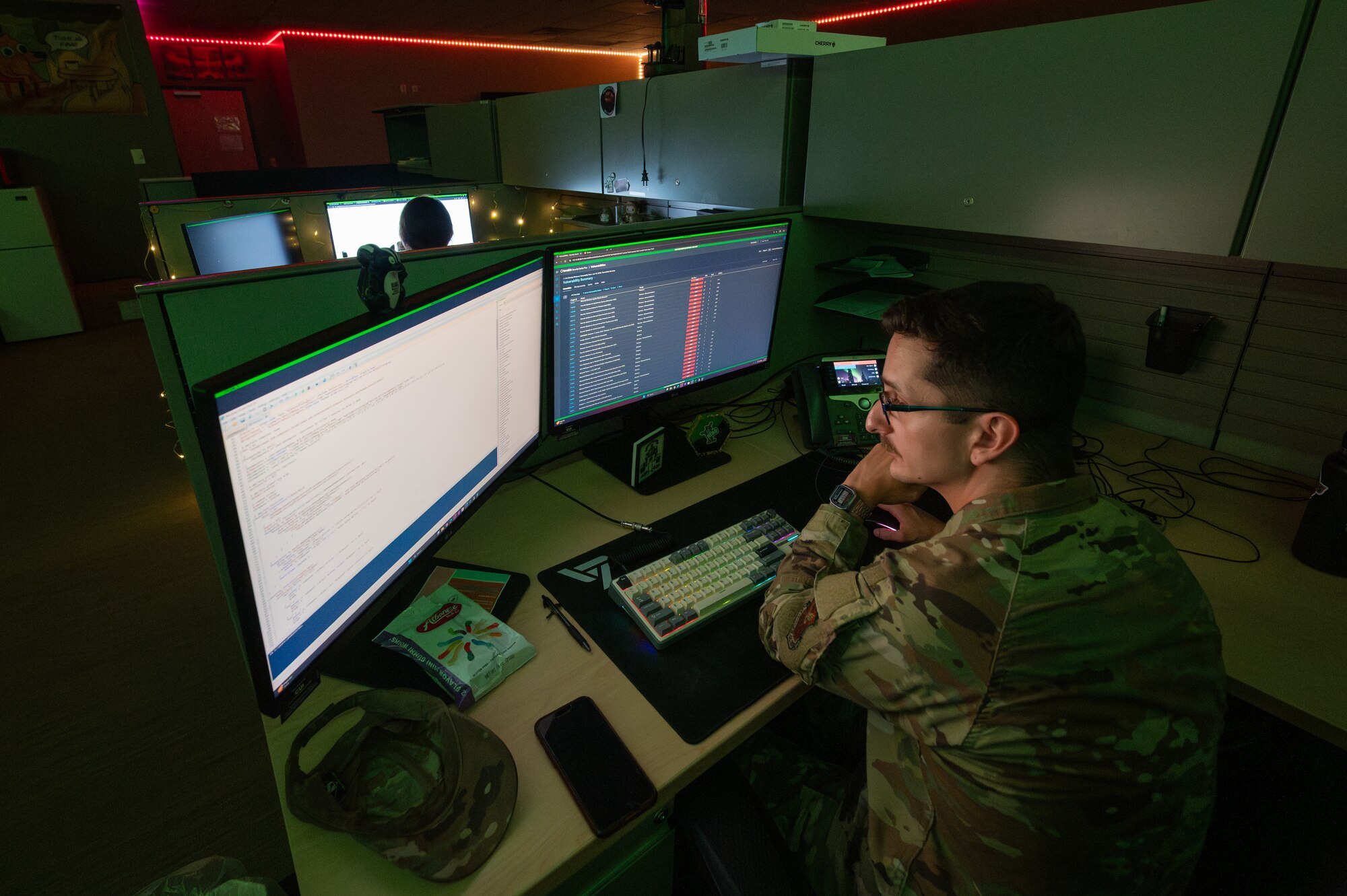 U.S. Air Force Senior Airman Nicholas Agriesti, 509th Communications Squadron cyber readiness technician, looks through code on his computer at Whiteman Air Force Base, Missouri, Aug. 11, 2025. Agriesti supports the mission at Whiteman AFB by providing cyber protection to all electronic devices across the installation. (U.S. Air Force photo by Senior Airman Joseph Garcia)