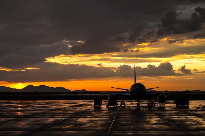 A U.S. Air Force KC-46 Pegasus aircraft sits on the flightline during sunrise at Altus Air Force Base, Oklahoma, Aug. 20, 2025. The aircraft was staged to support “Vapor Trails”, a joint medical exercise focused on aeromedical evacuation and critical care air transport training. (U.S. Air Force photo by Airman 1st Class Lauren Torres)
