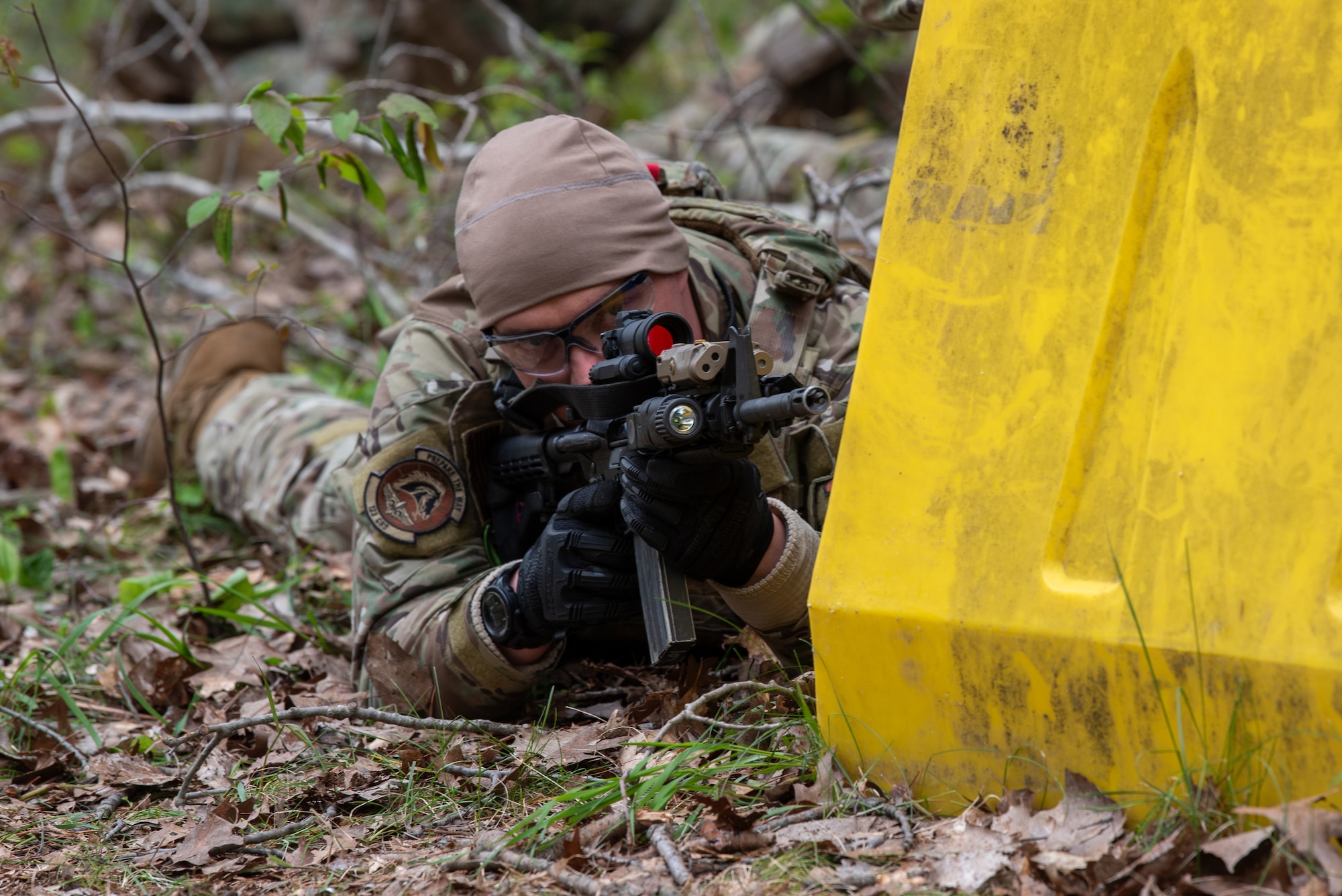 Senior Airman Jacob Hall, a fireteam member with the Kentucky Air National Guard’s 123rd Contingency Response Group, practices unmounted patrol maneuvers at the Alpena Combat Readiness Training Center in Alpena, Michigan, May 25, 2025.